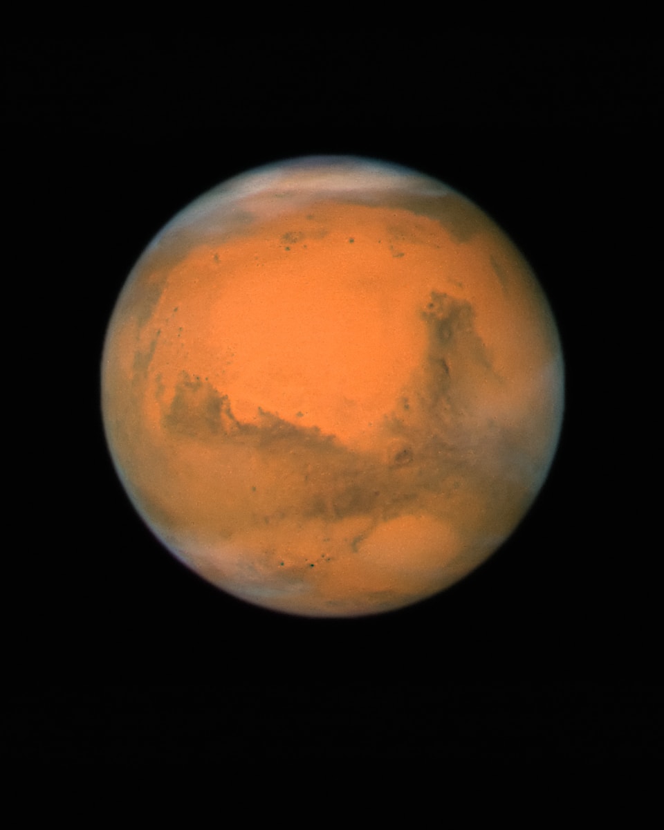 a red planet with a black background